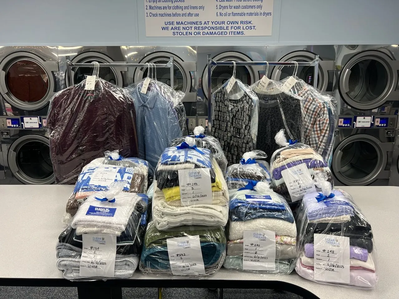 Folded wash and fold laundry orders ready for customers